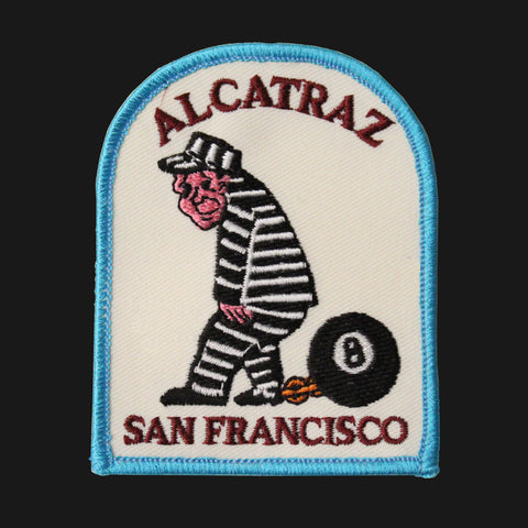 Iron on Alcatraz San Francisco patch with  a prisoner in ball and chains.