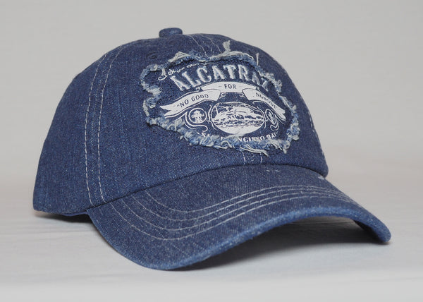 Denim baseball cap with "Alcatraz No Good for Nobody, San Francisco Bay" patch on the front. Color denim blue.
