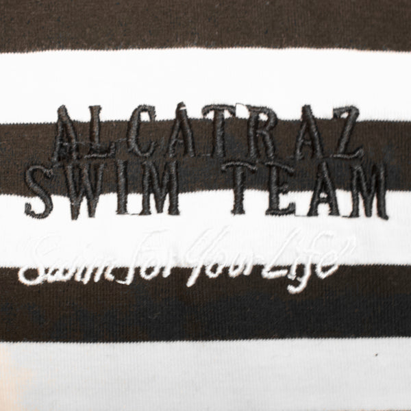 Close up of embroidered "Alcatraz Swim Team" logo 