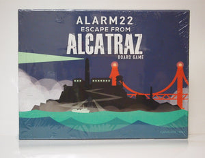 The front box art from the Alarm22 Escape from Alcatraz Board Game. Picture of Alcatraz Island silhouette with The Golden Gate Bridge in the background.