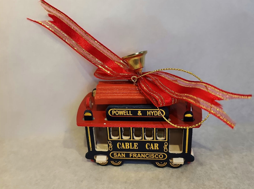 San Francisoc Cable Car Christmas Ornament. Blue and red with red ribbon bow.
