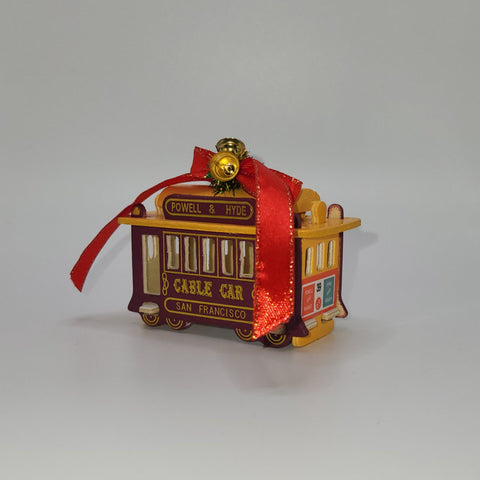 San Francisoc Cable Car Christmas Ornament. Maroon and yellow with red ribbon bow.
