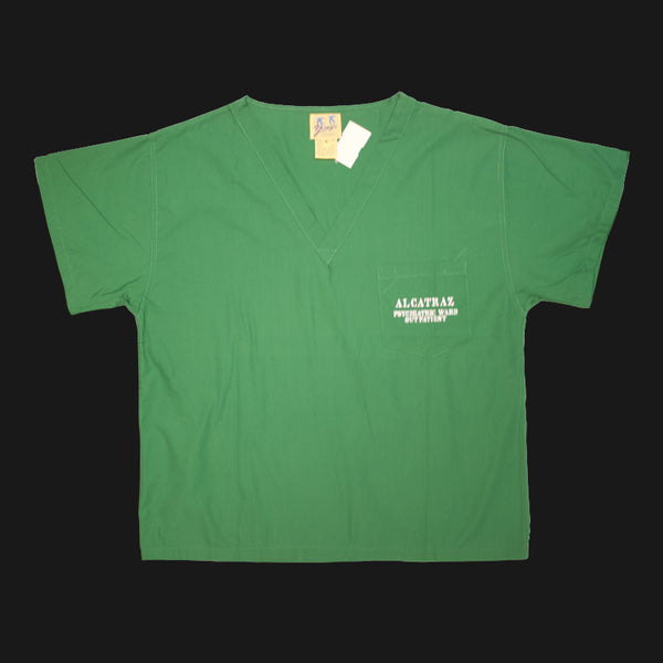 A green v-neck scrub short sleeves shirt with "Alcatraz psychiatric ward outpatient" on the left chest pocket.