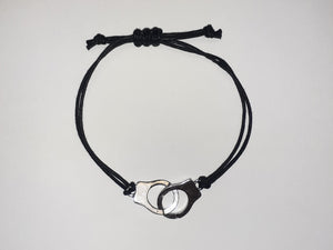 Adjustable string handcuff bracelet